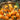 Fresh orange loquats gathered in a woven basket